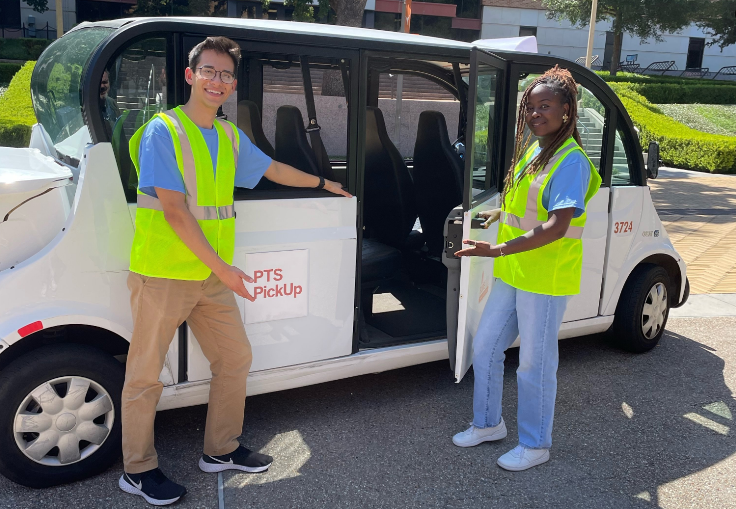 Two PTS Pickup drivers opening a cart door