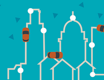 cars traveling around buildings