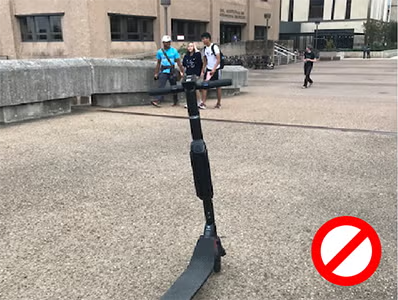 scooter parked on a pedestrian plaza