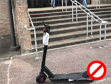 scooter parked in front of stairs