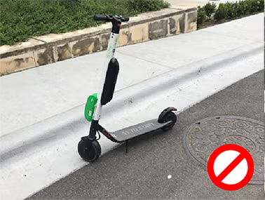 scooter parked on the edge of the street