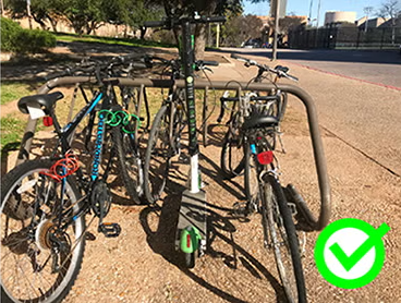 scooter parked in a bike rack